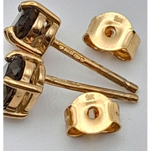 863 - A Pair of 9K Yellow Gold Smoky Quart Earrings. 0.82g total weight.