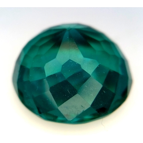 907 - A Bluish Green 71ct Round Cut Grandidierite Gemstone. Round cut with a well faceted trillion base. 2... 