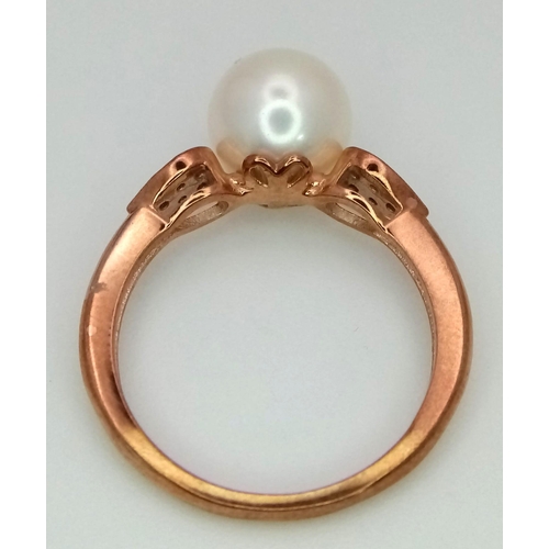 928 - A 9K rose gold cultured pearl and diamond ring. Round cut diamonds - 0.10ct. Size N. 3.03g total wei... 