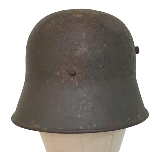 120 - Inter War Period German Friekorps Helmet. A WW1 Imperial German M18 Helmet shell with a 1935 model l... 