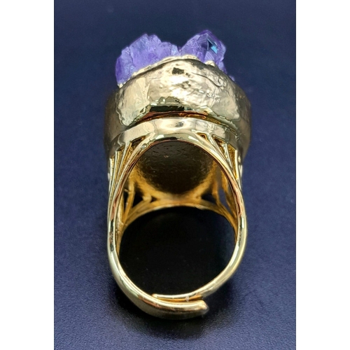 181 - A rare, heavily gilded bangle and ring set with natural amethyst crystals. Ring size: Adjustable, to... 