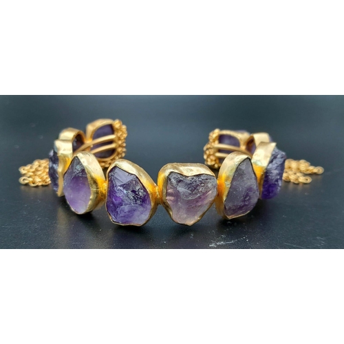 181 - A rare, heavily gilded bangle and ring set with natural amethyst crystals. Ring size: Adjustable, to... 