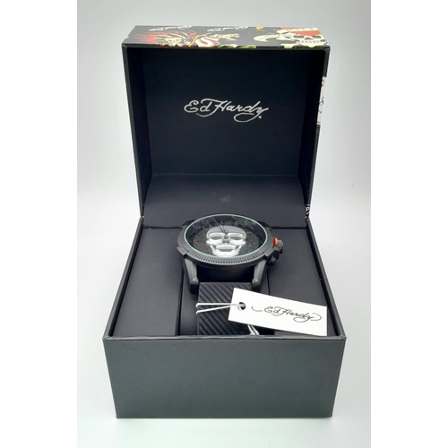 903 - Three brand new ED HARDY watches. Large case 46 mm, black bezel and dial, two with the emblematic sc... 