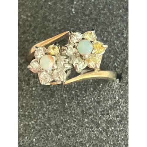 41 - Beautiful 9 carat GOLD and OPAL RING in unusual double crossover style with twin mounted OPALS set t... 