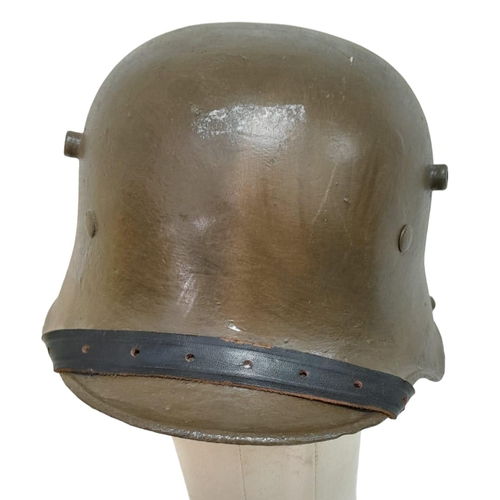 639 - Re-painted WW1 German M-16 Stahlhelm helmet with improvised liner and incorrect chin strap. Ideal st... 