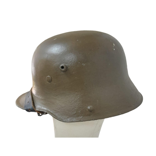 639 - Re-painted WW1 German M-16 Stahlhelm helmet with improvised liner and incorrect chin strap. Ideal st... 