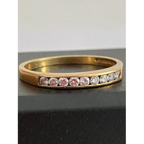 84 - 18 carat GOLD and DIAMOND RING, Slim style having 9 Round cut DIAMONDS channel set to top. Full UK h... 