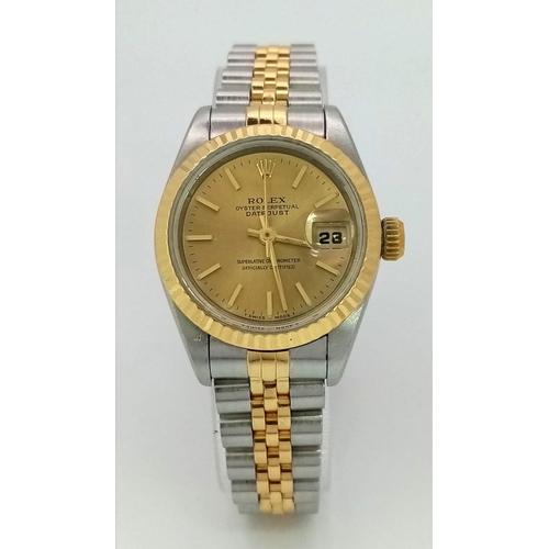 394 - A LADIES ROLEX OYSTER PERPETUAL DATEJUST BI-METAL WATCH WITH GOLDTONE DIAL .  26mm