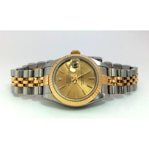 394 - A LADIES ROLEX OYSTER PERPETUAL DATEJUST BI-METAL WATCH WITH GOLDTONE DIAL .  26mm