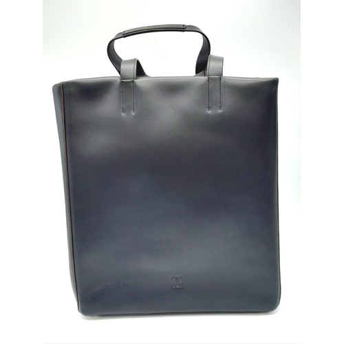 878 - A Luxury Loewe Black Leather Papelle Tote Bag. Soft black leather exterior. Red textile interior wit... 