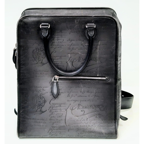 319 - A Berluti Black Leather Satchel. Exterior in scritto leather design with zipped pocket. Spacious bei... 