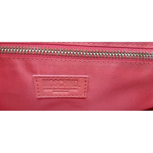 866 - A Moschino Red Leather Handbag. Soft leather exterior with gilded furniture. Black leather strap. Re... 