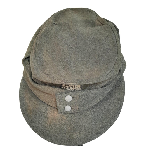 141 - 3 rd Reich Waffen SS M43 Ski Cap. Period related small tear on the top. Overall good condition for i... 