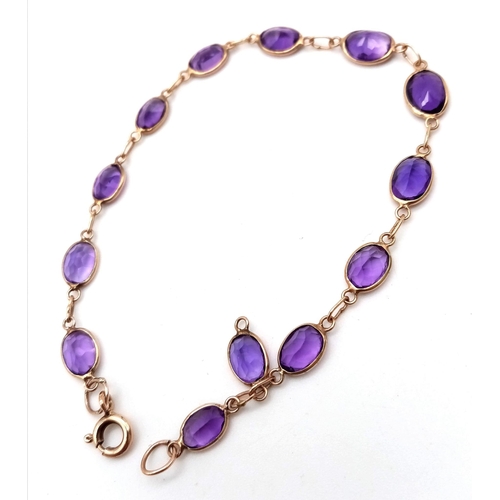 354 - A 9K ROSE GOLD AND AMETHYST BRACELET .   3.4gms   18cms