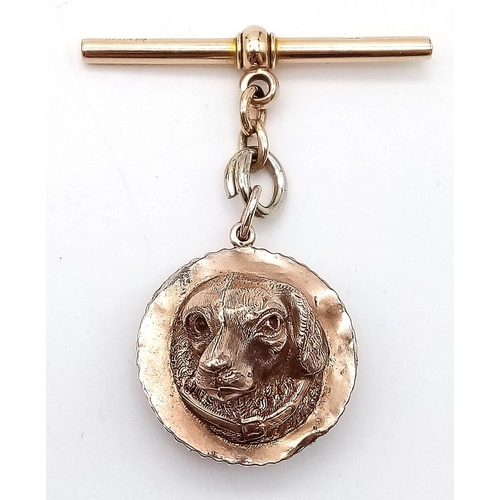 367 - A 9K GOLD WATCH CHAIN FOB WITH ANTIQUE COMPASS AND DOGS HEAD REVERSE .10gms