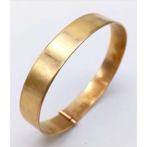 87 - A SOLID 9K GOLD BANGLE .  19.1gms