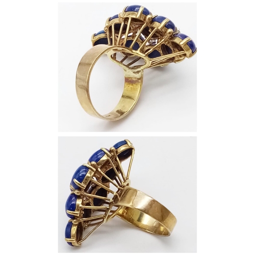 88 - A DESIGNER 18K GOLD RING WITH LAPIS LAZULI AND DIAMONDS .   10.4gms