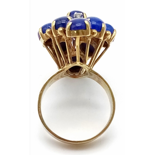 88 - A DESIGNER 18K GOLD RING WITH LAPIS LAZULI AND DIAMONDS .   10.4gms