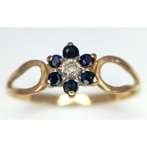 403 - 9k yellow gold sapphire and diamond flower ring, size O, 1.2g (dia:0.01ct/sapp:0.30ct)