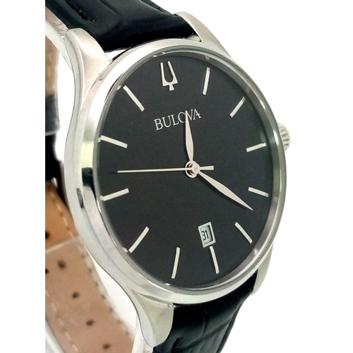 438 - A Classic Bulova Quartz Unisex Watch. Black leather strap. Stainless steel case - 36mm. Black dial w... 