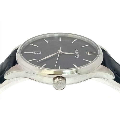 438 - A Classic Bulova Quartz Unisex Watch. Black leather strap. Stainless steel case - 36mm. Black dial w... 