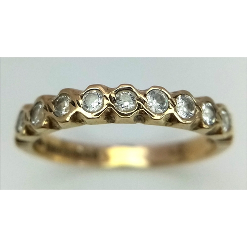 498 - 9k yellow gold 9 stone CZ set half eternity ring, size N, 1.8g