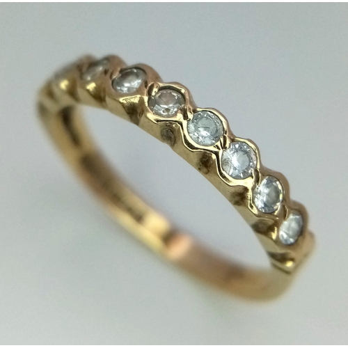 498 - 9k yellow gold 9 stone CZ set half eternity ring, size N, 1.8g