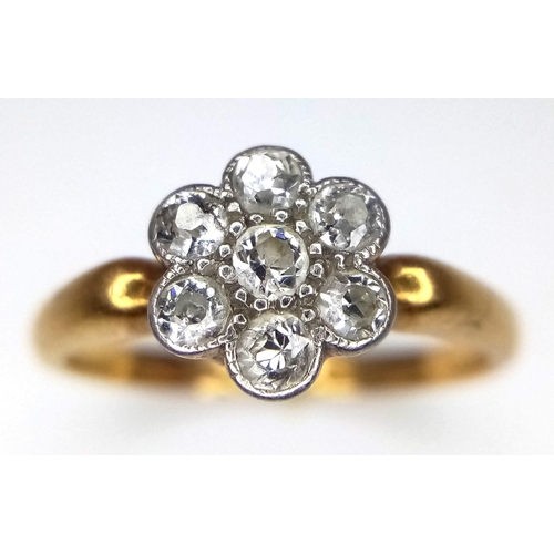 66 - AN 18K GOLD DIAMOND CLUSTER RING IN FLORAL FORM , WITH A CHESTER HALLMARK.   2.5gms   size K