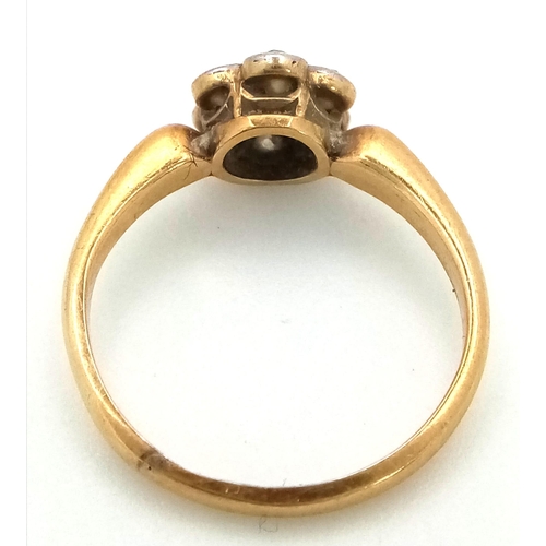 66 - AN 18K GOLD DIAMOND CLUSTER RING IN FLORAL FORM , WITH A CHESTER HALLMARK.   2.5gms   size K