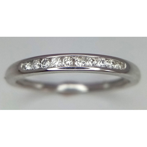 663 - 18k white gold diamond channel set half eternity ring, size L, weight 1.6g (dia:0.10ct)