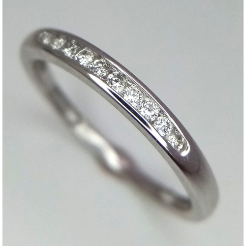 663 - 18k white gold diamond channel set half eternity ring, size L, weight 1.6g (dia:0.10ct)