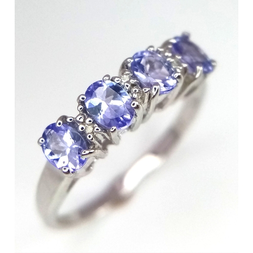 717 - 9k white gold diamond and iolite dress ring, size L, weight 1.9g (dia:0.03ct/iolite:0.70ct)