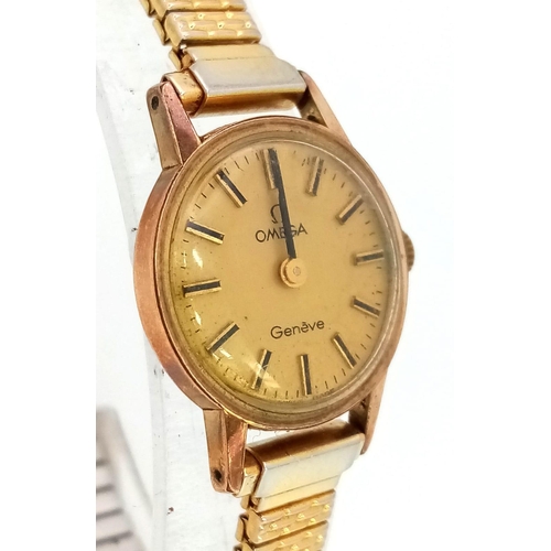 879 - A Vintage Ladies Omega Geneve. Expandable gilded bracelet.
Two tone case - 20mm. Gold tone dial. Mec... 