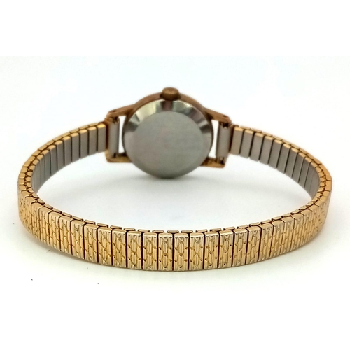 879 - A Vintage Ladies Omega Geneve. Expandable gilded bracelet.
Two tone case - 20mm. Gold tone dial. Mec... 