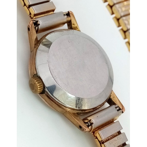 879 - A Vintage Ladies Omega Geneve. Expandable gilded bracelet.
Two tone case - 20mm. Gold tone dial. Mec... 