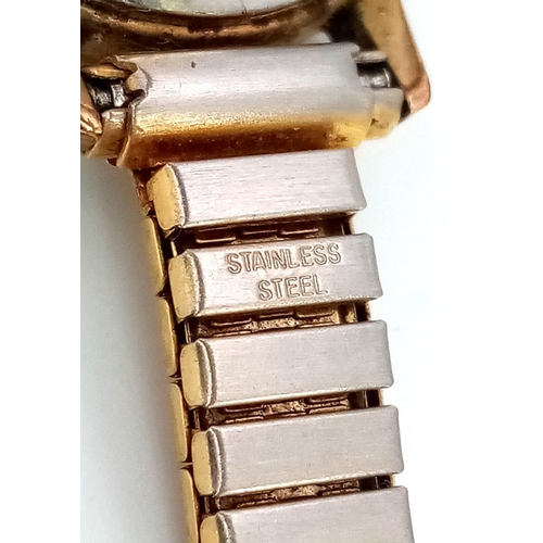 879 - A Vintage Ladies Omega Geneve. Expandable gilded bracelet.
Two tone case - 20mm. Gold tone dial. Mec... 