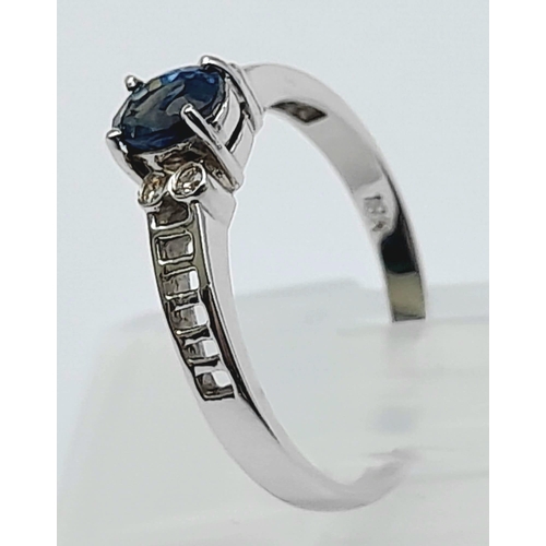 232 - 18K WHITE GOLD DIAMOND & SAPPHIRE RING 0.62CT OVAL SAPPHIRE 

WEIGHT: 2.2G 
SIZE L