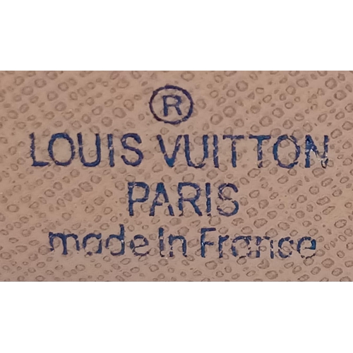 451 - A Louis Vuitton Wallet. Brown monogram canvas exterior. Slight tear on interior. 11cm x 10cm.