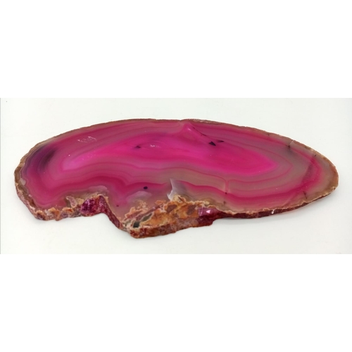 564 - An Ancient Piece of Sliced Pink Agate. 16cm x 9cm.