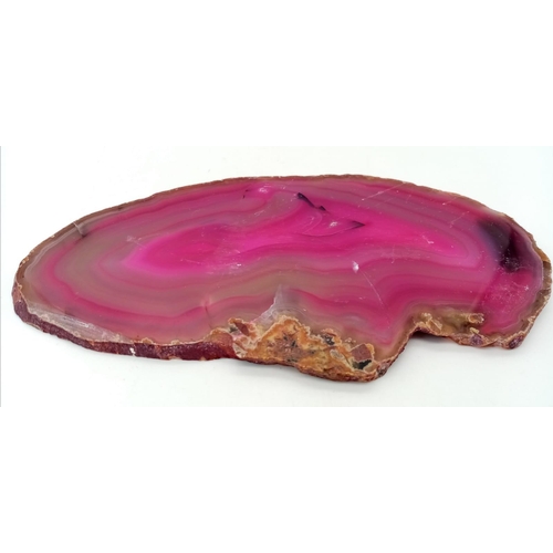 564 - An Ancient Piece of Sliced Pink Agate. 16cm x 9cm.