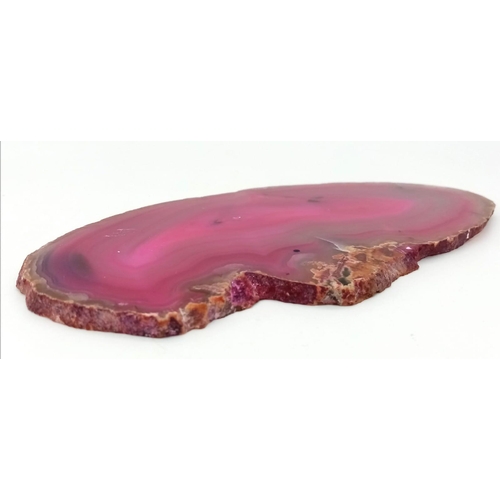 564 - An Ancient Piece of Sliced Pink Agate. 16cm x 9cm.