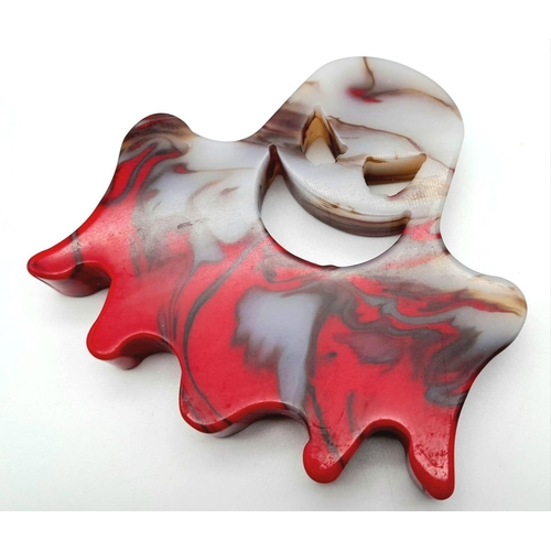 821 - A Hand-Carved Flame Agate Spectre. Figure or ghoulish paperweight. 8cm x 8cm.