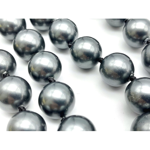 828 - A South Sea Pearl Metallic Grey Shell Bead Necklace. 12mm beads. Necklace length - 44cm