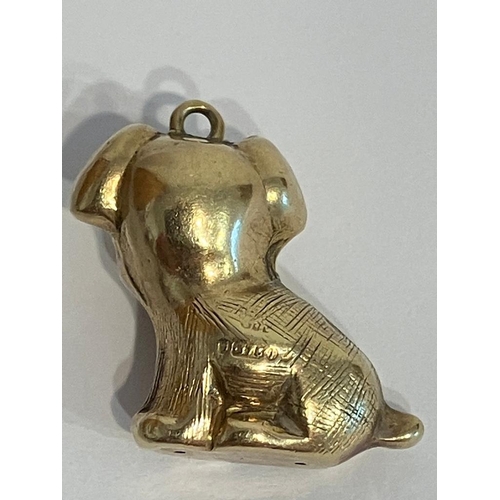 231 - 9 carat GOLD PUPPY CHARM/PENDANT. Red jewel eyes. Full UK hallmark. 1.4 grams.