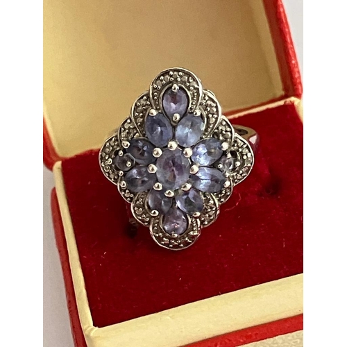 294 - Magnificent TANZANITE CLUSTER RING set in SILVER with beaded Silver surround. Presented in jewellers... 