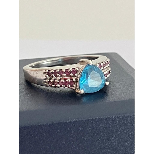 539 - Beautiful SILVER and AQUAMARINE TOPAZ RING, Having a trillion cut Aquamarine Topaz Solitaire mounted... 