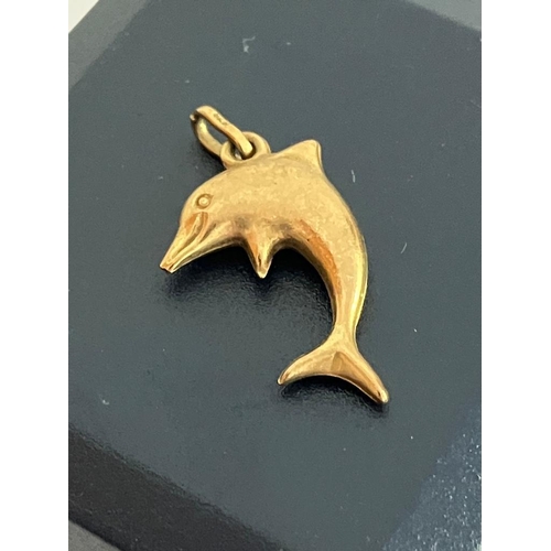 567 - 9 carat GOLD DOLPHIN CHARM. 0.45 grams.