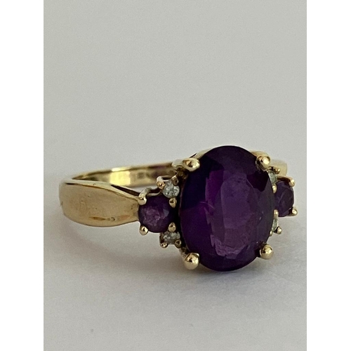 581 - Lovely 9 carat GOLD AMETHYST and DIAMOND RING , comprising a large (2.0 carat)  oval cut AMETHYST SO... 