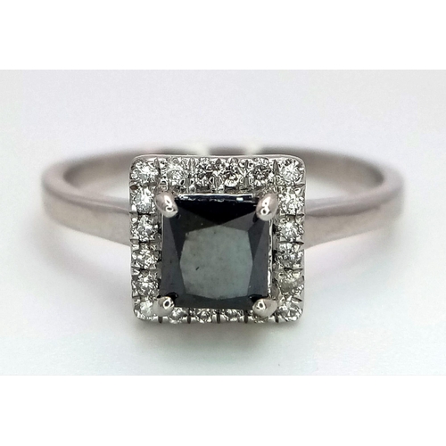 26 - A WGI certified platinum ring set with square-cut black diamond and a halo of twenty round brilliant... 