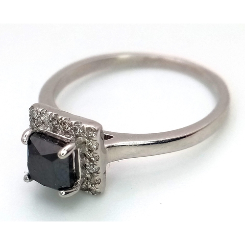 26 - A WGI certified platinum ring set with square-cut black diamond and a halo of twenty round brilliant... 